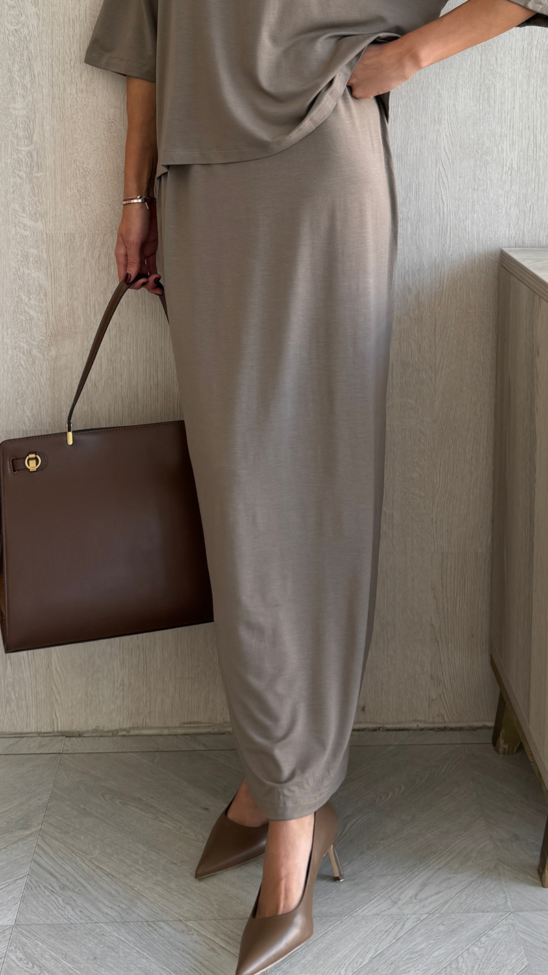 taupe draped midi skirt paired with a matching loose top